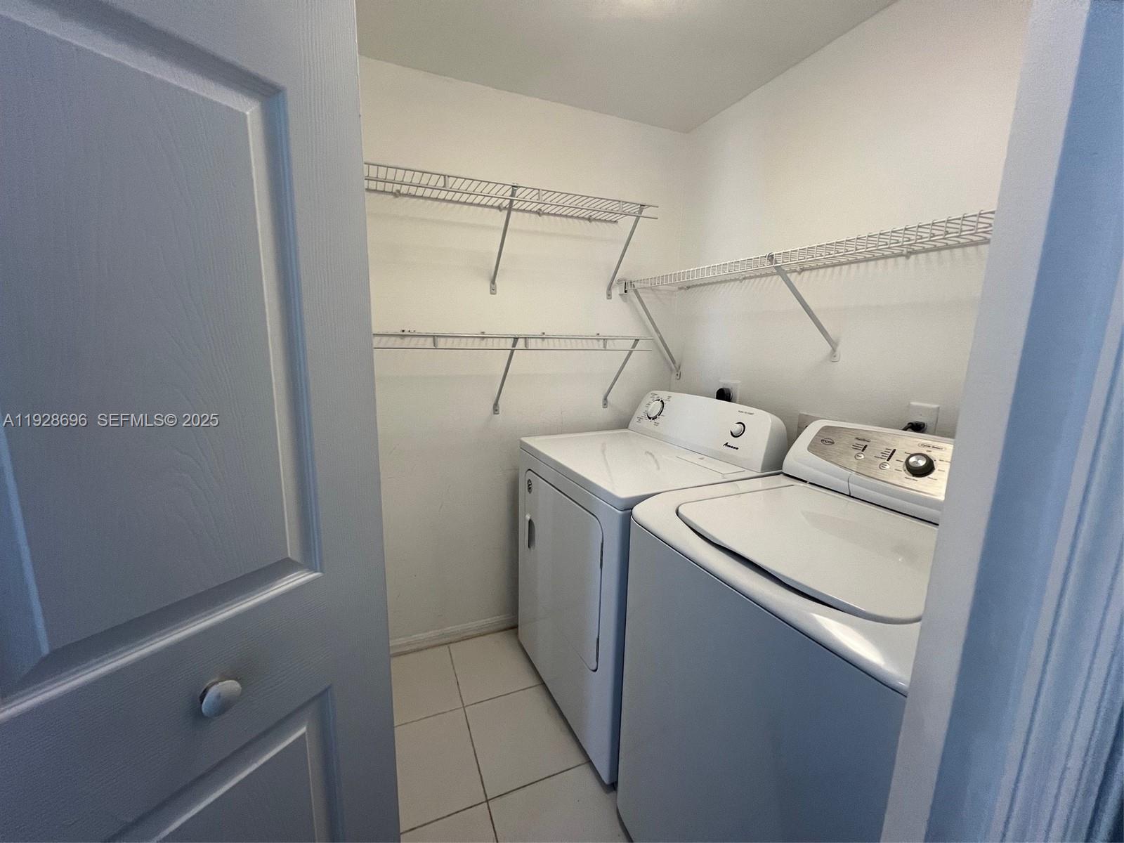 2406 Centergate Drive, Unit 201 Miramar, FL 33025 - Photo 18 of 41 a utility room with dryer and washer