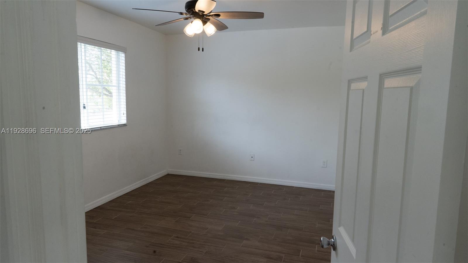 2406 Centergate Drive, Unit 201 Miramar, FL 33025 - Photo 19 of 41 an empty room with windows and fan
