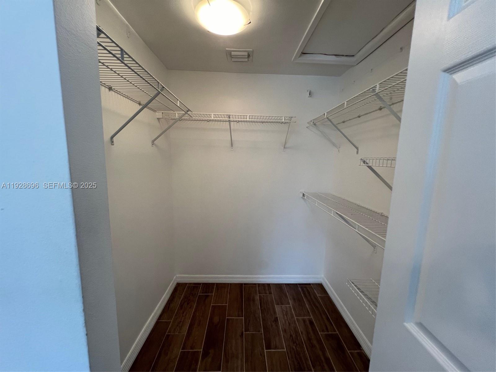 2406 Centergate Drive, Unit 201 Miramar, FL 33025 - Photo 23 of 41 a view of a room with racks on the wall