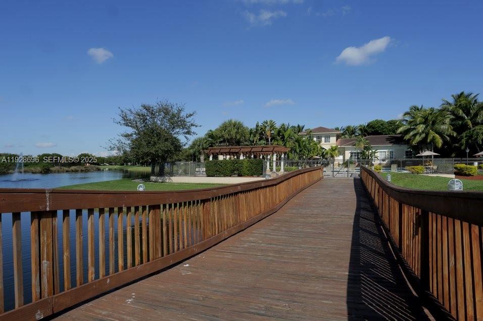 2406 Centergate Drive, Unit 201 Miramar, FL 33025 - Photo 33 of 41 a view of swimming pool and lake view