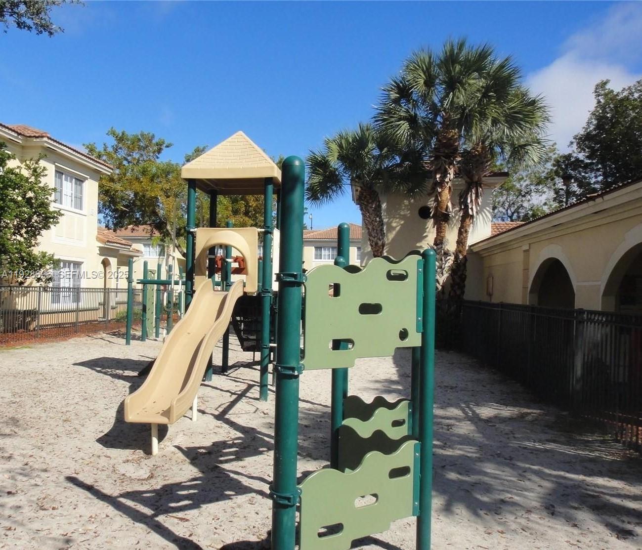 2406 Centergate Drive, Unit 201 Miramar, FL 33025 - Photo 38 of 41 a front view of a house with a yard