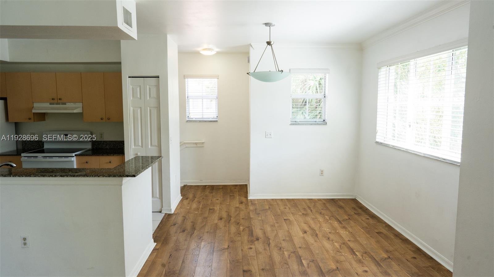 2406 Centergate Drive, Unit 201 Miramar, FL 33025 - Photo 10 of 41 a view of a kitchen cabinets and wooden floor