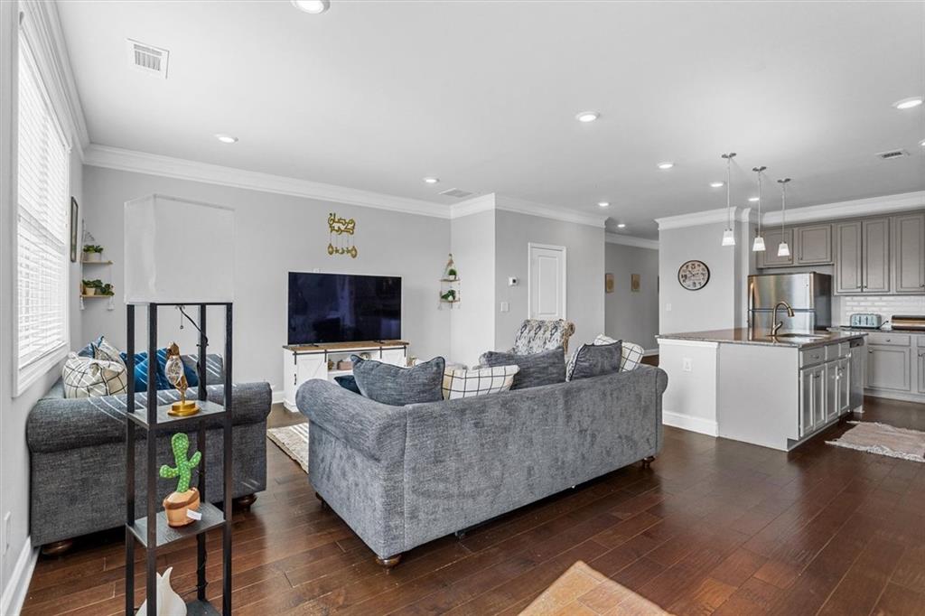 2787 Pearl Rdg Trace Buford, GA 30519 - Photo 29 of 52 a living room with furniture and a flat screen tv
