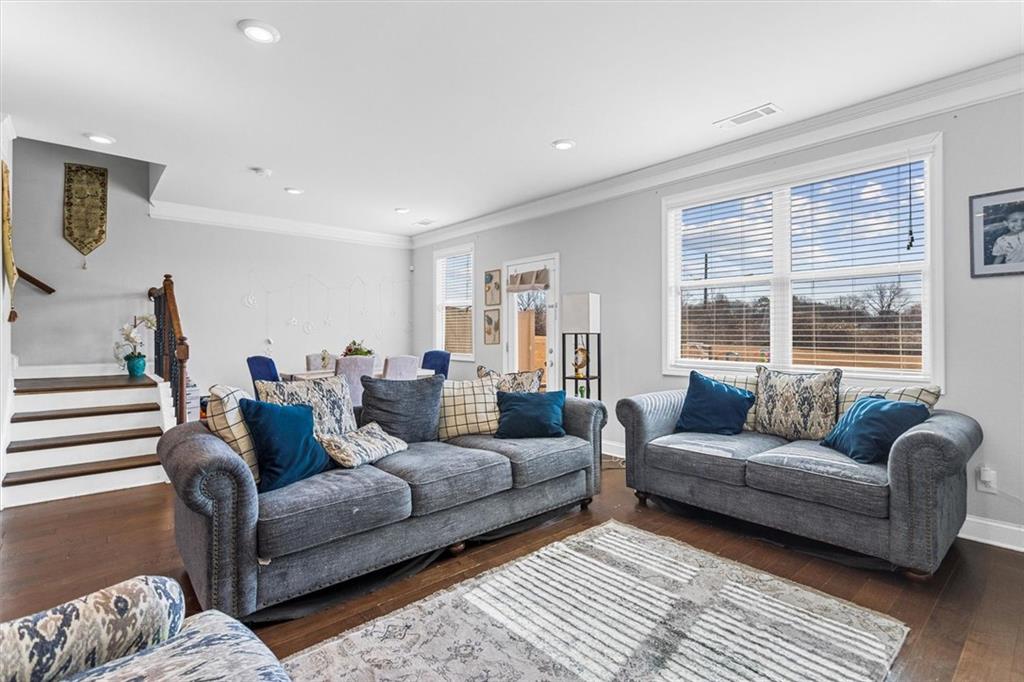2787 Pearl Rdg Trace Buford, GA 30519 - Photo 30 of 52 a living room with furniture and a large window