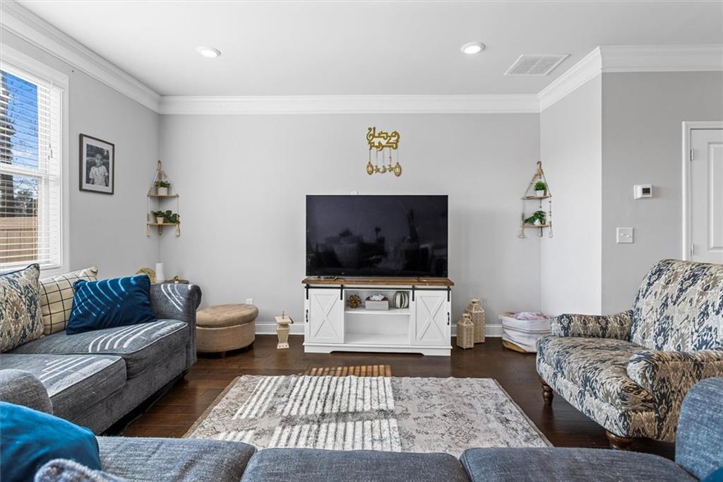 2787 Pearl Rdg Trace Buford, GA 30519 - Photo 32 of 52 a living room with furniture and a flat screen tv