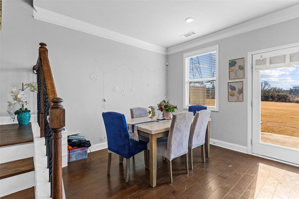2787 Pearl Rdg Trace Buford, GA 30519 - Photo 34 of 52 a view of a dining room with furniture and wooden floor