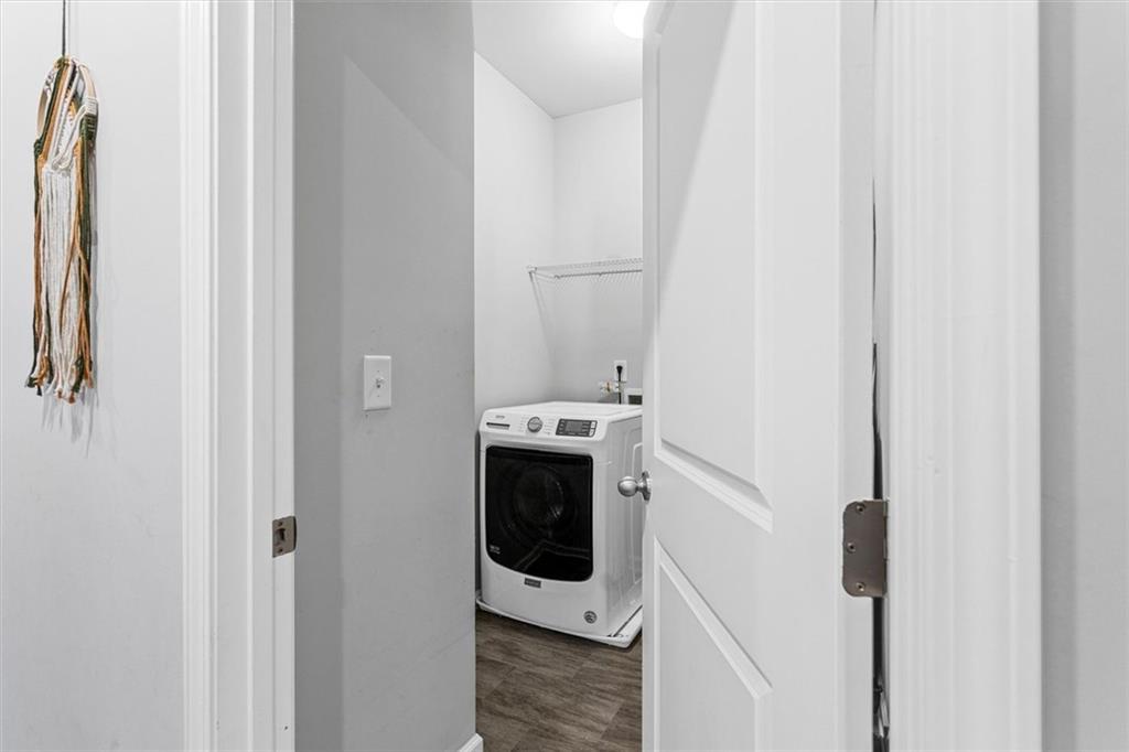 2787 Pearl Rdg Trace Buford, GA 30519 - Photo 38 of 52 a bathroom with a sink and washing machine