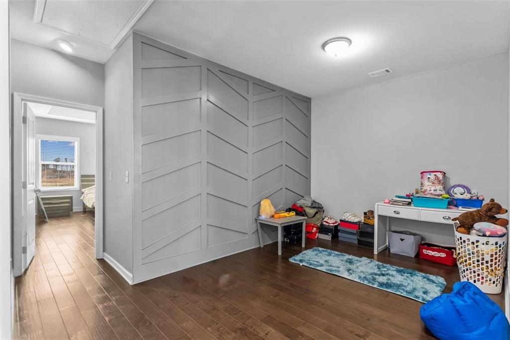 2787 Pearl Rdg Trace Buford, GA 30519 - Photo 39 of 52 a children room with toys and wooden floor