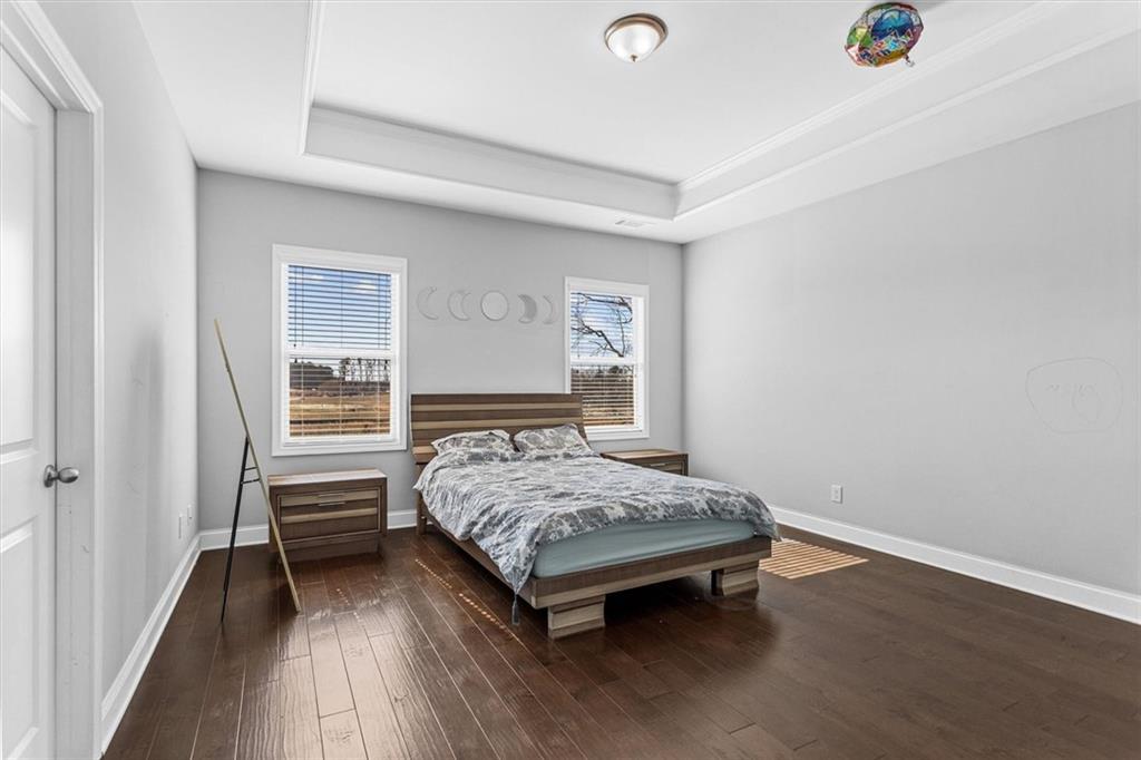 2787 Pearl Rdg Trace Buford, GA 30519 - Photo 40 of 52 a bedroom with a bed and a window