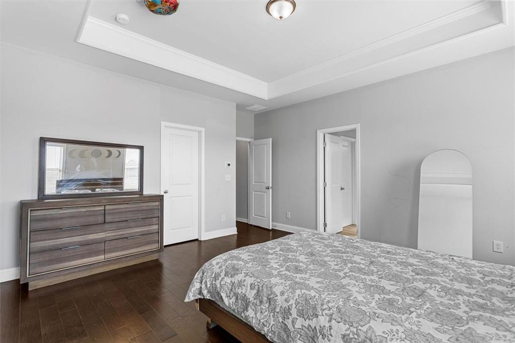 2787 Pearl Rdg Trace Buford, GA 30519 - Photo 42 of 52 a bedroom with a bed and a dresser