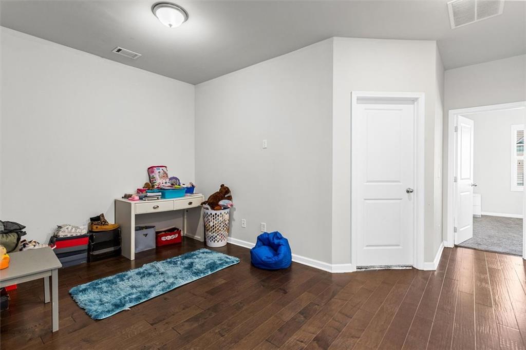 2787 Pearl Rdg Trace Buford, GA 30519 - Photo 45 of 52 a view of play room with toys and wooden floor