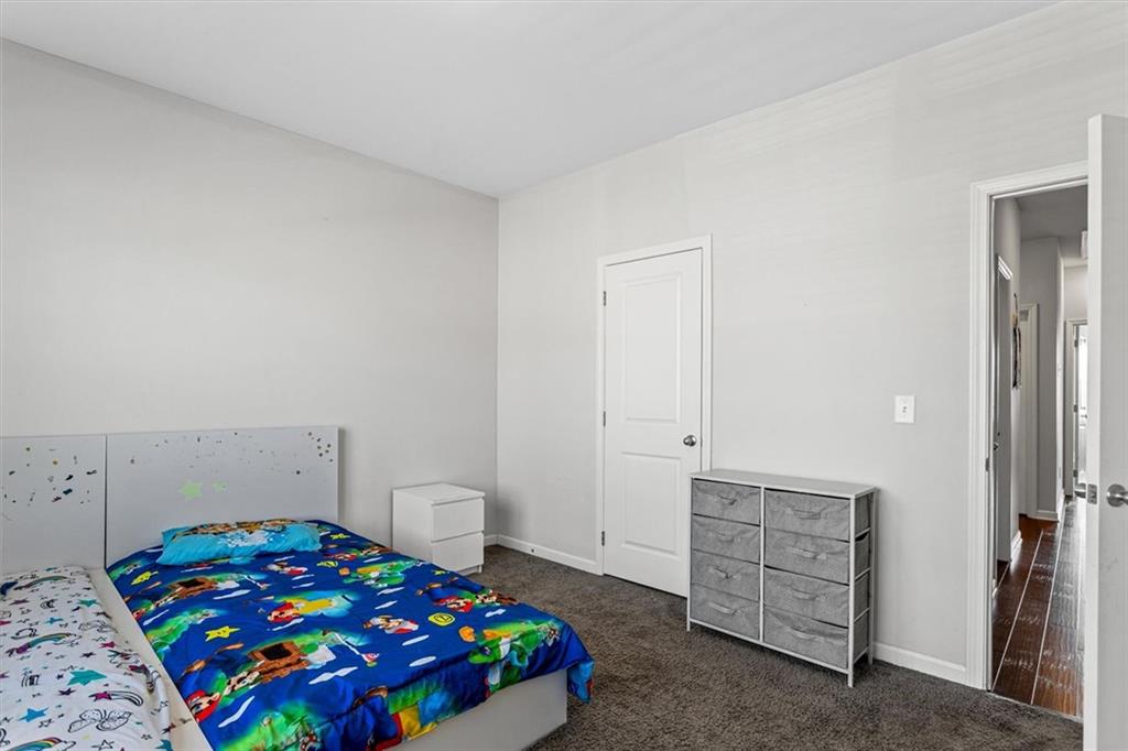 2787 Pearl Rdg Trace Buford, GA 30519 - Photo 50 of 52 a bedroom with a bed and a cabinets