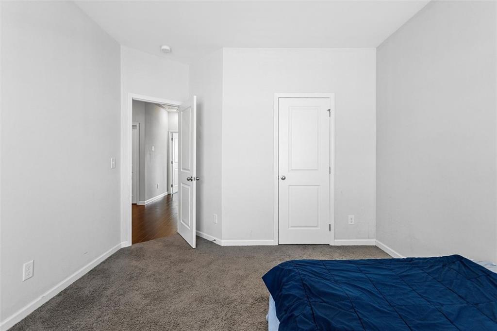 2787 Pearl Rdg Trace Buford, GA 30519 - Photo 52 of 52 a view of room with wooden floor and entryway