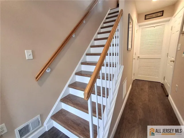 a kitchen with wooden floors and appliances