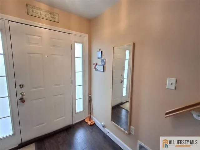 a view of a door with wooden floor