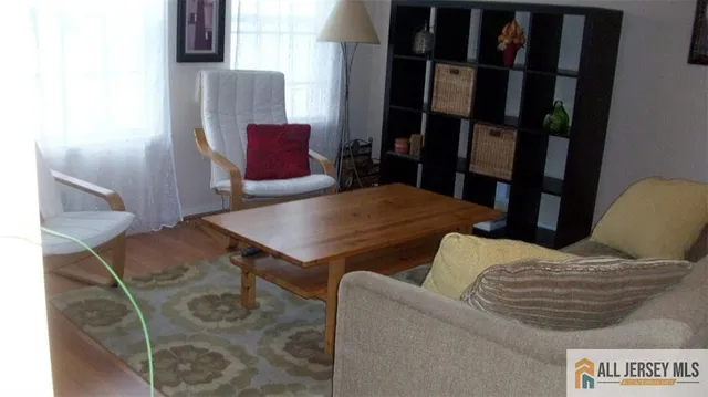 a bathroom with a toilet and a mirror