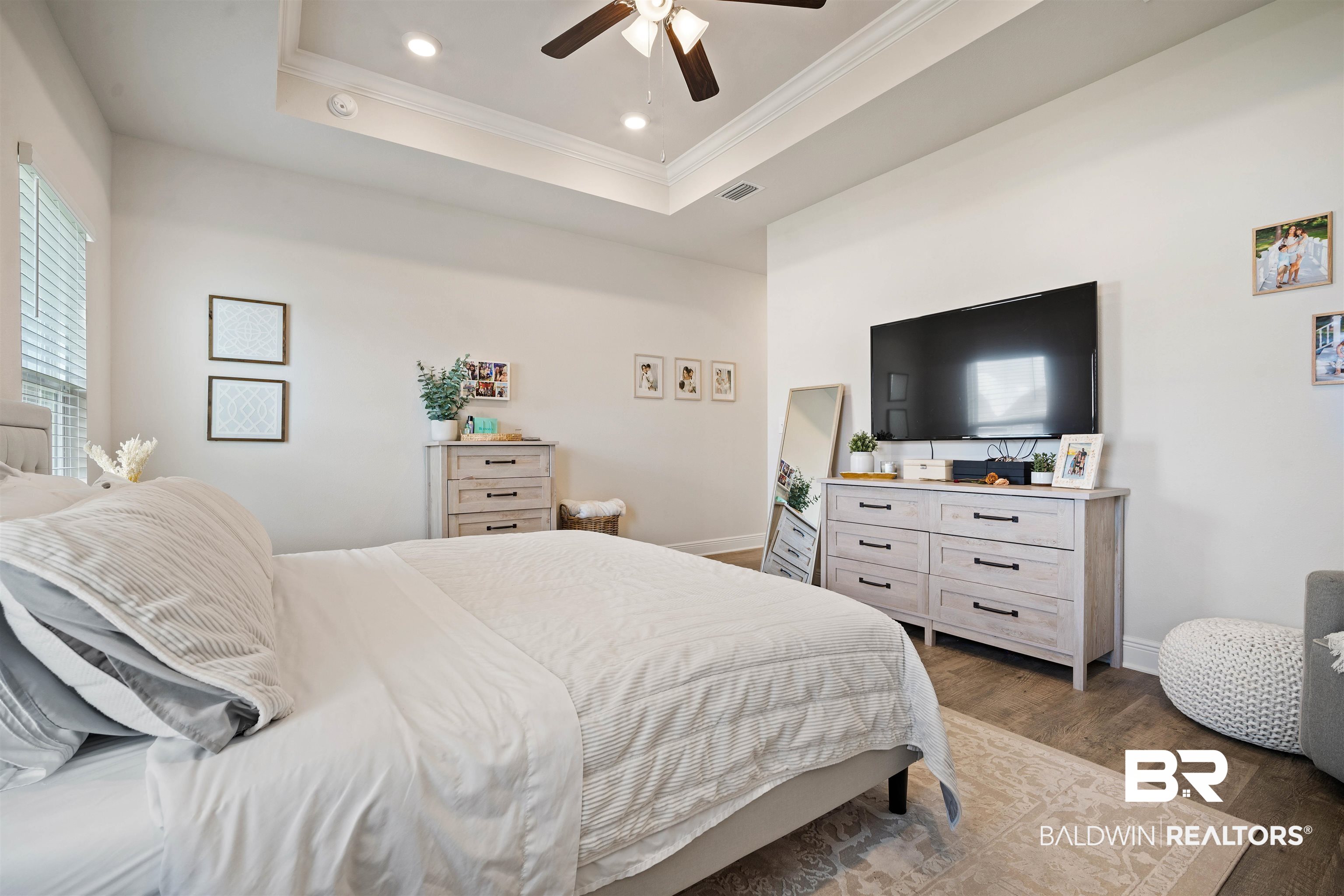 11021 Native Dancer Way Daphne, AL 36526 - Photo 12 of 35 Bedroom featuring crown molding, ceiling fan, a raised ceiling, dark wood-style flooring, and recessed lighting
