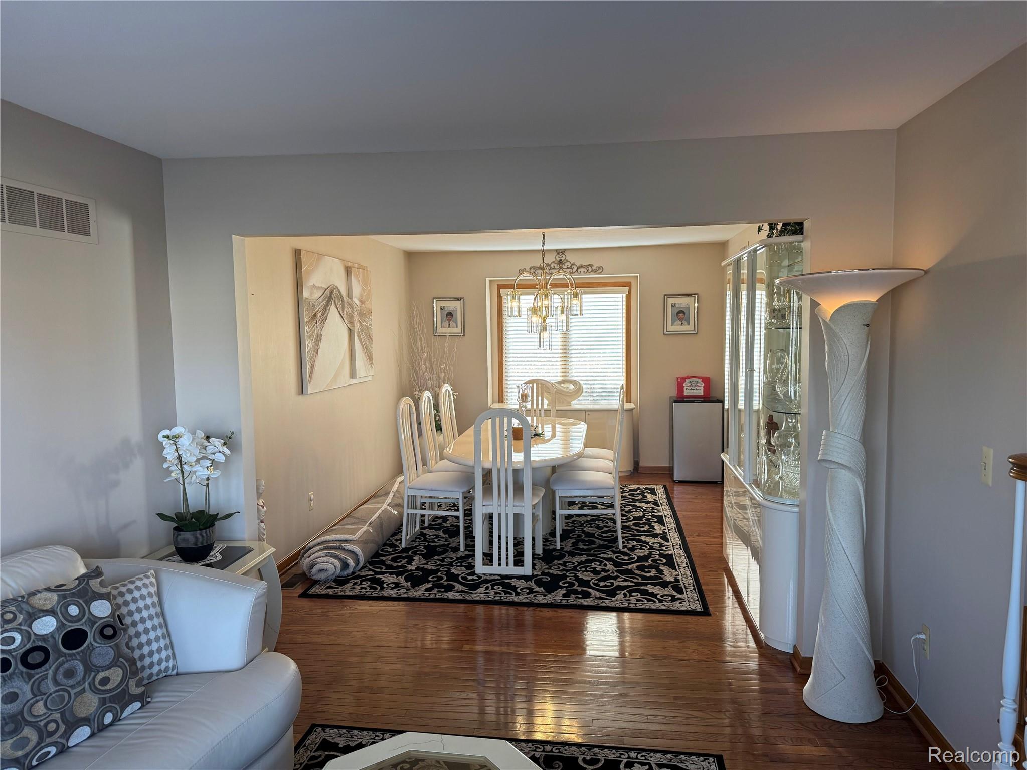 48583 Tilch Road Macomb, MI 48044 - Photo 19 of 53 Dining space with wood finished floors and suspended lighting