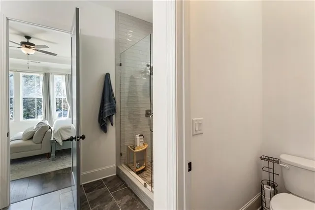 a kitchen with stainless steel appliances granite countertop white cabinets and stove