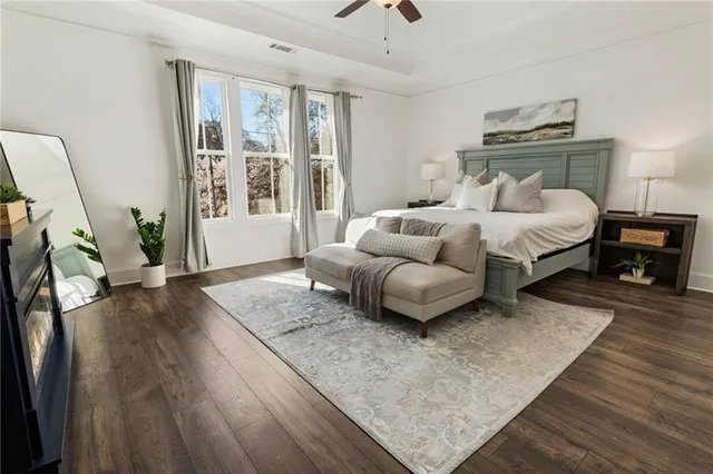 a view of a hallway with wooden floor and entryway