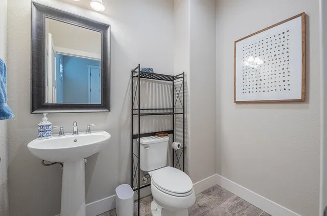 a view of hallway with furniture and wooden floor