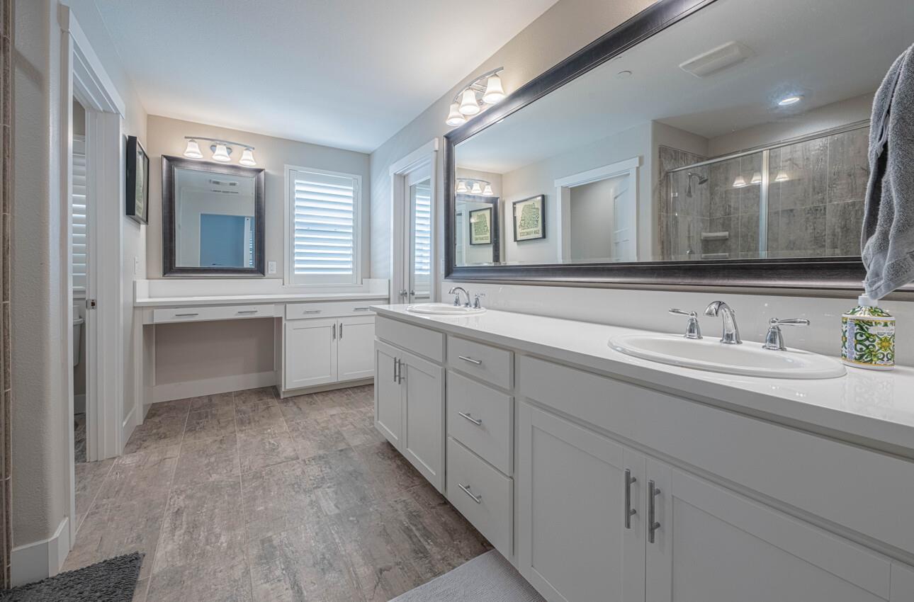 19130 Fallingwater Lane Marina, CA 93933 - Photo 22 of 43 a spacious bathroom with a granite countertop sink mirror and