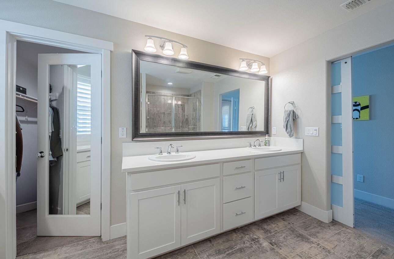 19130 Fallingwater Lane Marina, CA 93933 - Photo 23 of 43 a spacious bathroom with double sink and a mirror