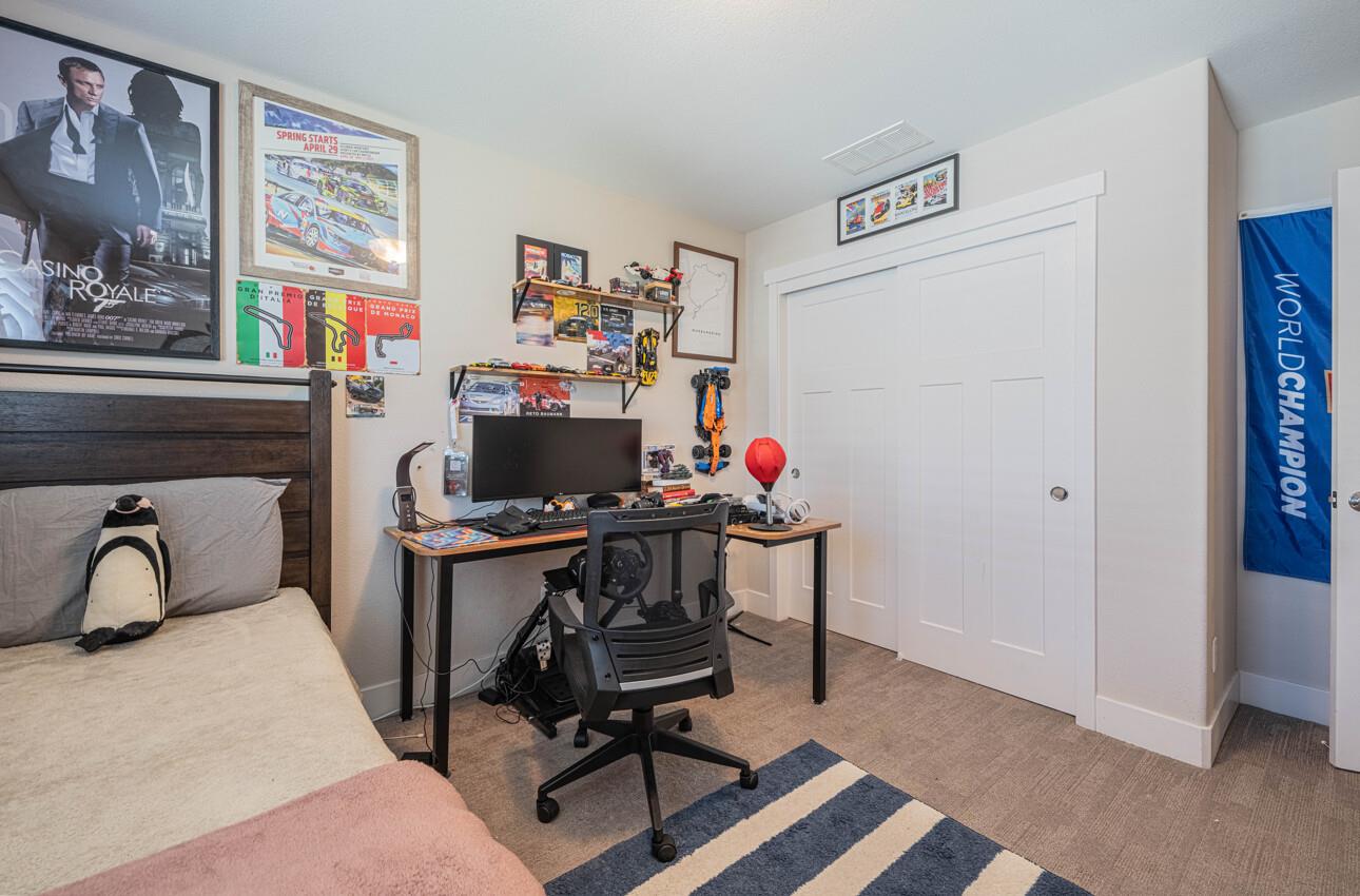 19130 Fallingwater Lane Marina, CA 93933 - Photo 27 of 43 a room with furniture and paintings on the wall