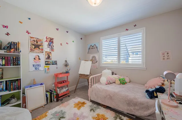 a bathroom with a toilet and a shower curtain
