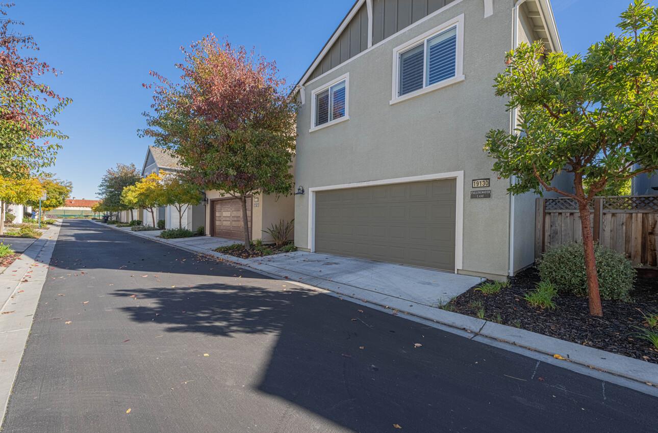 19130 Fallingwater Lane Marina, CA 93933 - Photo 34 of 43 a front view of a house with a yard and garage