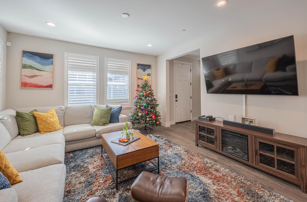 19130 Fallingwater Lane Marina, CA 93933 - Photo 4 of 43 a living room with furniture and a flat screen tv
