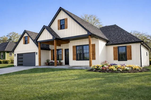 a front view of a house with garden