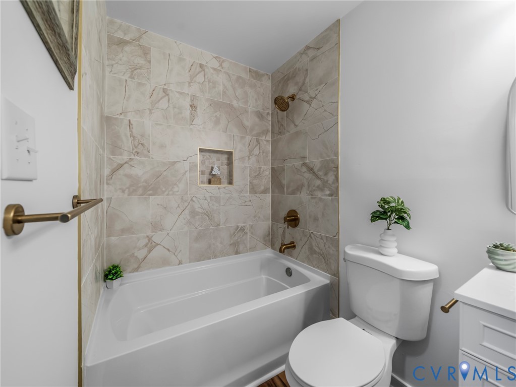 2509 Indale Road Glen Allen, VA 23060 - Photo 25 of 45 a white toilet sitting next to a bath tub