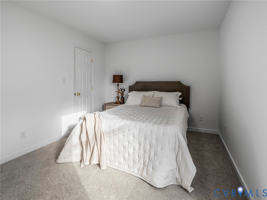 2509 Indale Road Glen Allen, VA 23060 - Photo 29 of 45 a bedroom with a bed and a night stand
