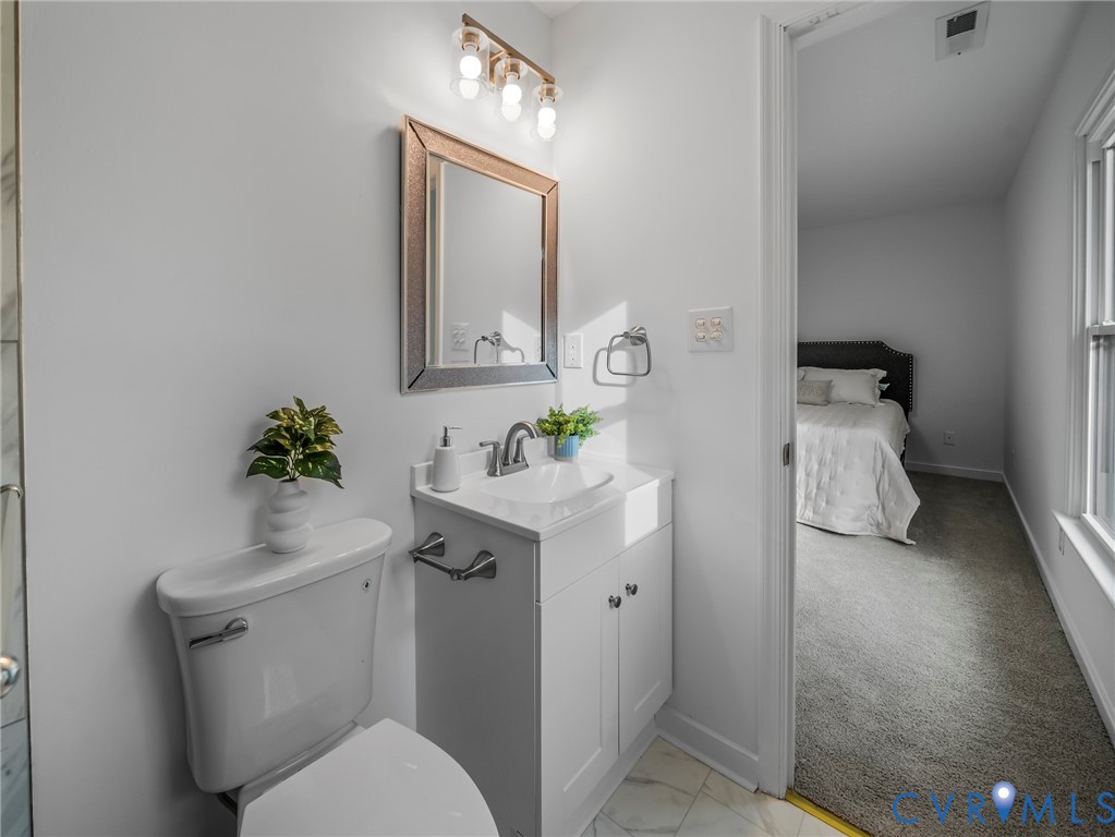 2509 Indale Road Glen Allen, VA 23060 - Photo 31 of 45 a bathroom with a toilet sink and mirror