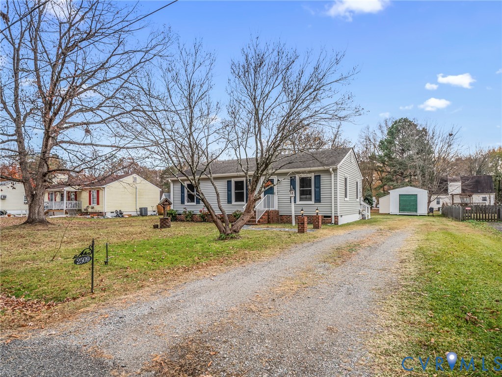 2509 Indale Road Glen Allen, VA 23060 - Photo 4 of 45 a view of a house with a yard and large trees
