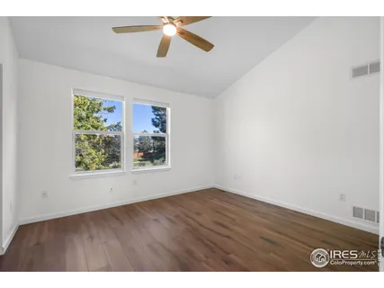 a kitchen with stainless steel appliances a sink a stove a refrigerator with cabinets