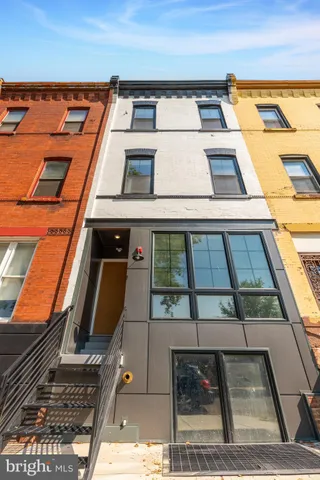 front view of a building with a yard