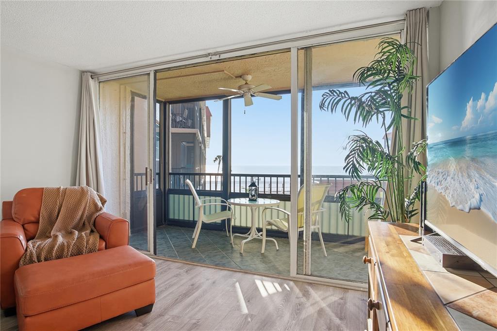 17580 Gulf Boulevard, Unit 302 Redington Shores, FL 33708 - Photo 11 of 37 a living room with furniture and a potted plant