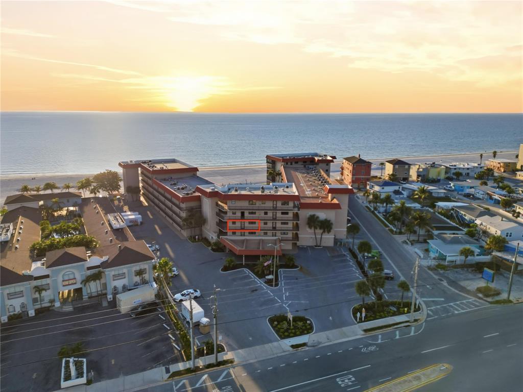 17580 Gulf Boulevard, Unit 302 Redington Shores, FL 33708 - Photo 2 of 37 an aerial view of a building with outdoor space