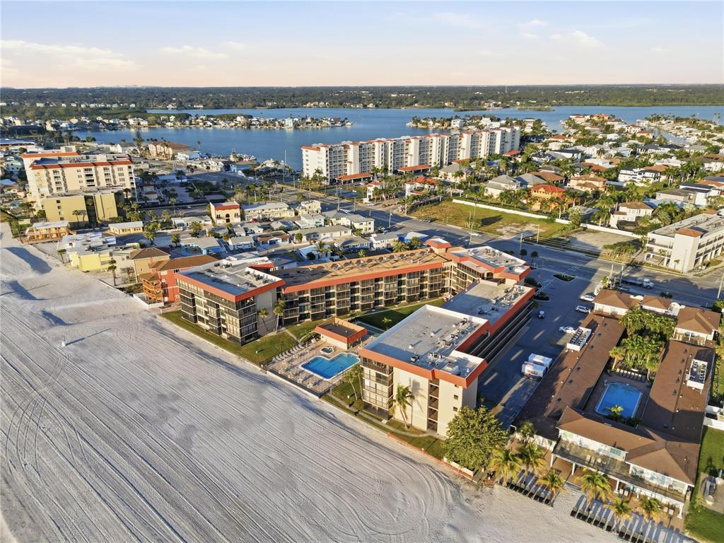 17580 Gulf Boulevard, Unit 302 Redington Shores, FL 33708 - Photo 25 of 37 an aerial view of a city with parking