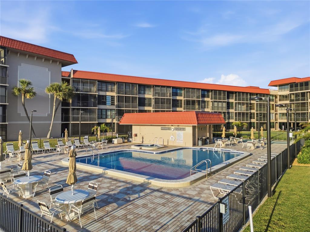 17580 Gulf Boulevard, Unit 302 Redington Shores, FL 33708 - Photo 27 of 37 a view of a swimming pool with a patio