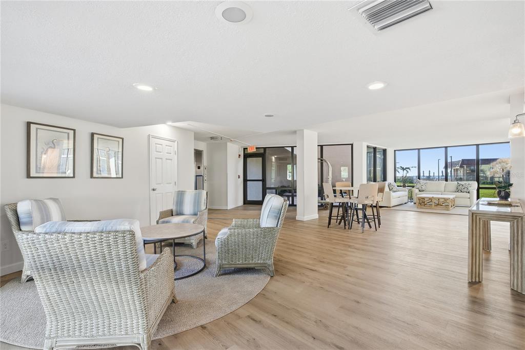 17580 Gulf Boulevard, Unit 302 Redington Shores, FL 33708 - Photo 31 of 37 a living room with furniture and a wooden floor