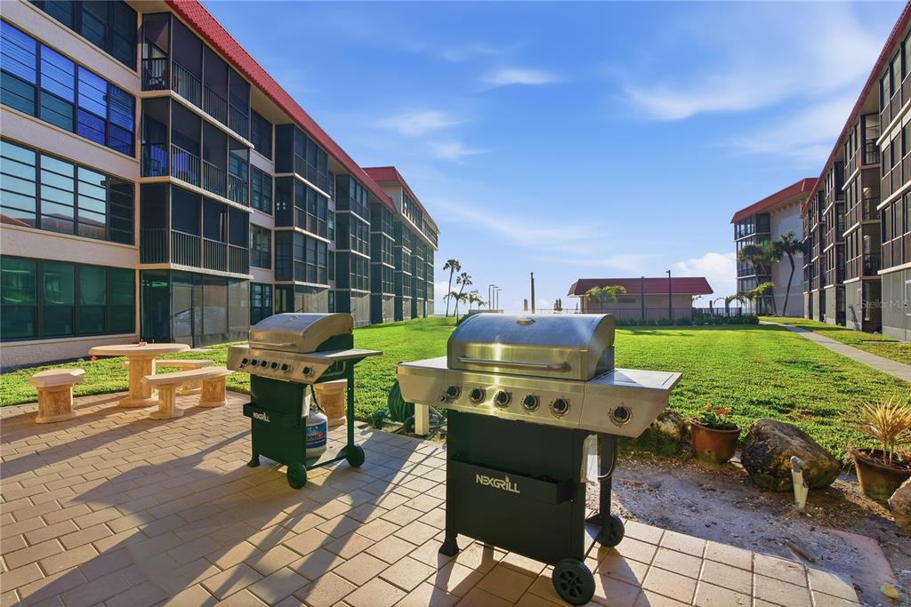 17580 Gulf Boulevard, Unit 302 Redington Shores, FL 33708 - Photo 35 of 37 a view of a chairs and table in the patio