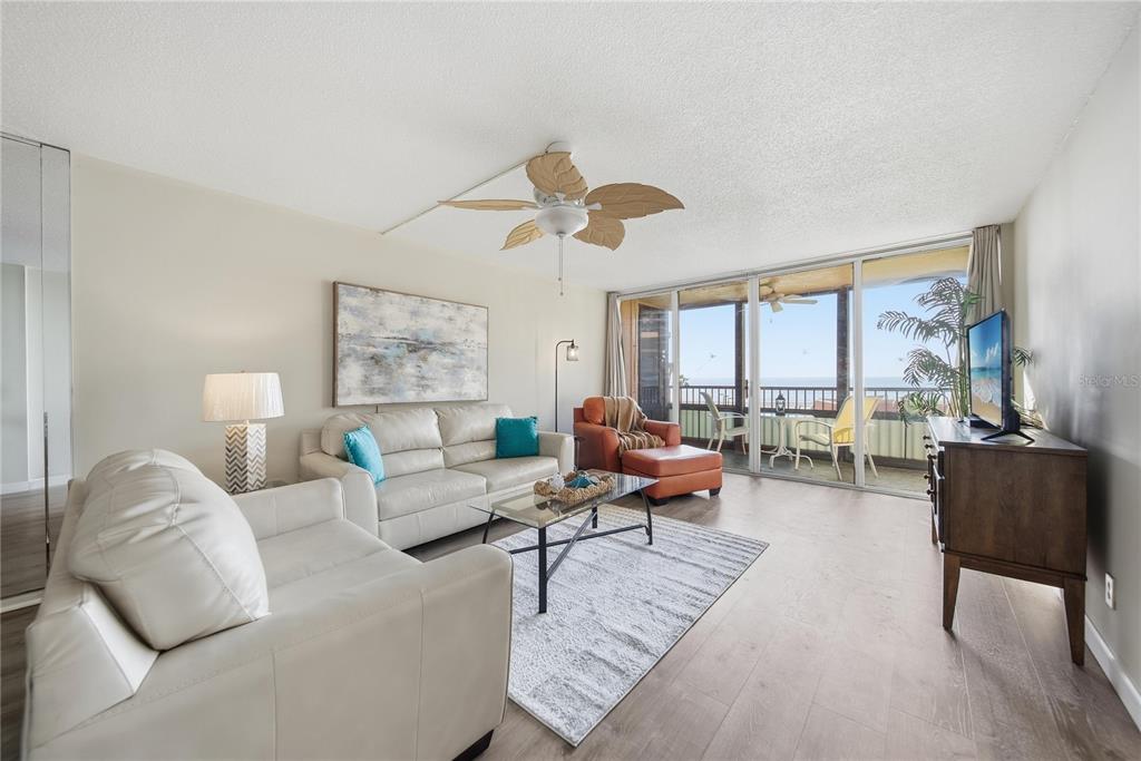 17580 Gulf Boulevard, Unit 302 Redington Shores, FL 33708 - Photo 10 of 37 a living room with furniture and a large window