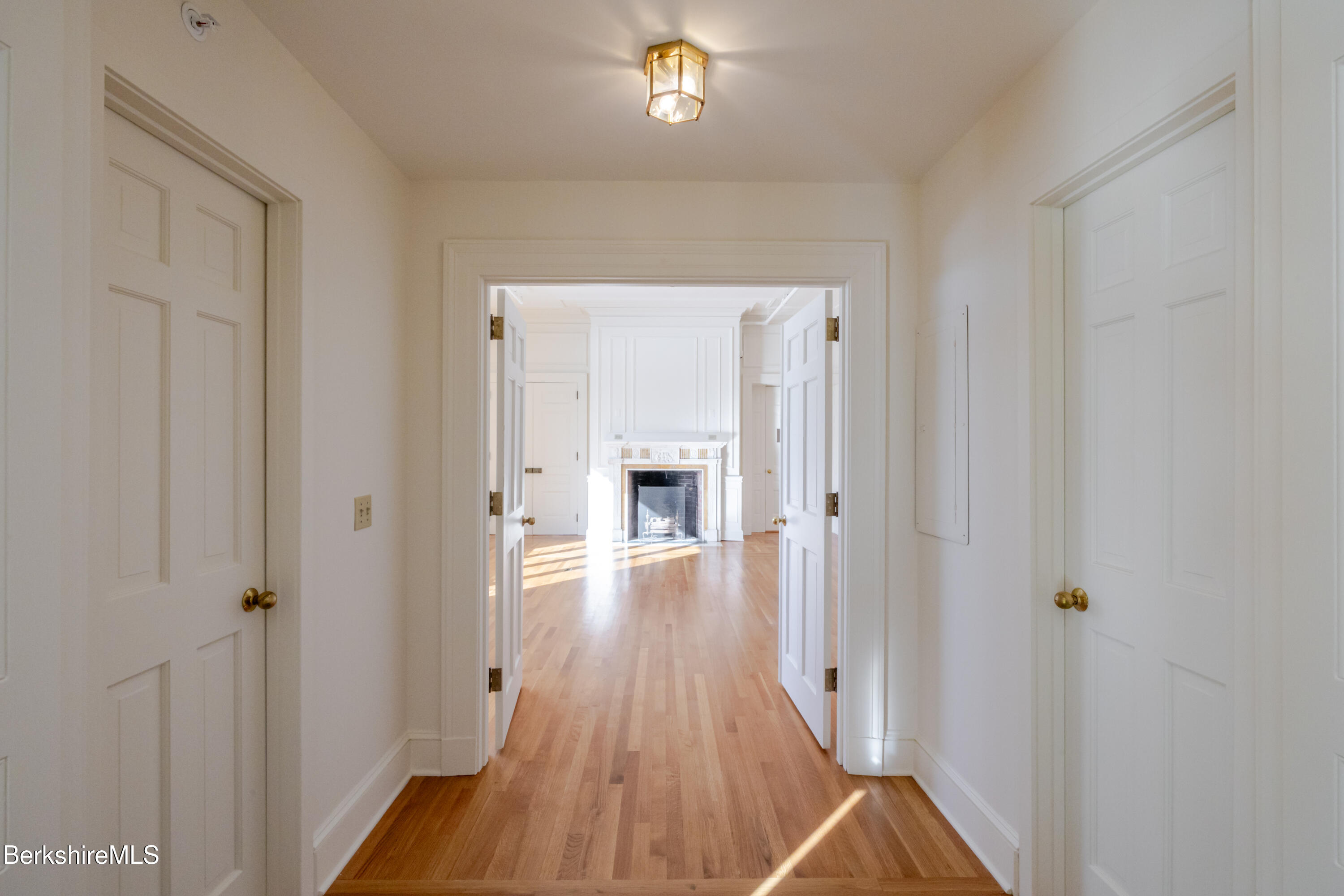 200 Vanna # 3 Old Stockbridge Road Stockbridge, MA 01262 - Photo 5 of 29 a view of a hallway with wooden floor and a bathroom