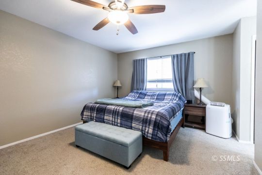 609 South Gemstone Street Ridgecrest, CA 93555 - Photo 24 of 35 a bedroom with a bed and window