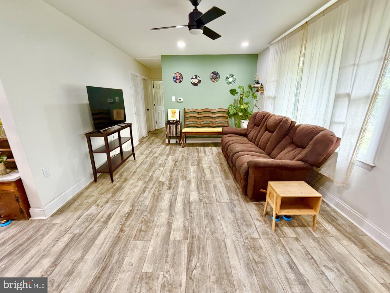 2413 Shelburn Road Millville, NJ 08332 - Photo 5 of 41 a living room with furniture and a flat screen tv