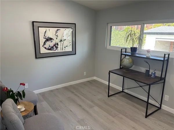 a workspace with furniture and a window