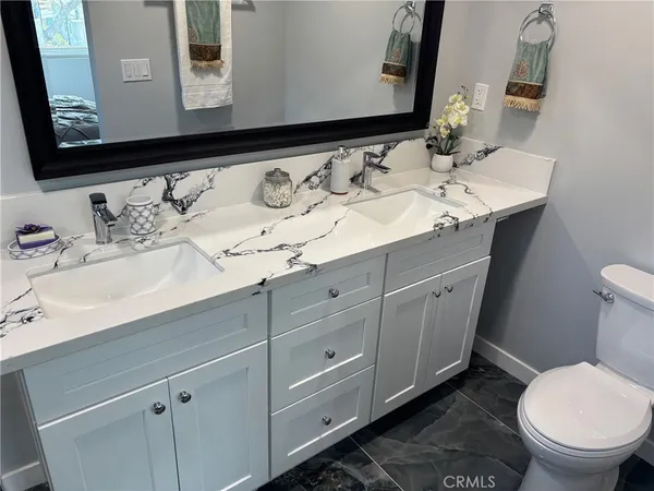 a bathroom with a sink and a toilet